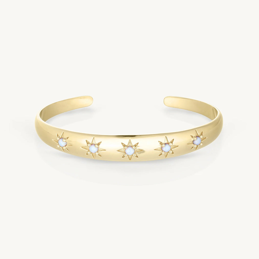 Gold bracelet with star designs on a white background