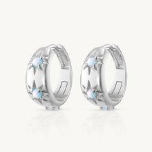 Load image into Gallery viewer, Pair of silver hoop earrings with small stones on a white background