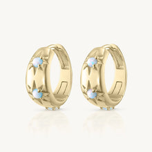 Load image into Gallery viewer, Pair of gold hoop earrings with small stones on a white background