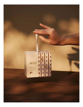 Load image into Gallery viewer, Calming Oatmeal Baby Care Travel Ornament - al.ive body