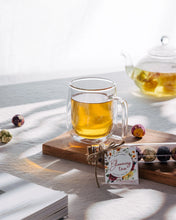 Load image into Gallery viewer, Blooming Tea Balls in Glass Tube - Better Tea Co.
