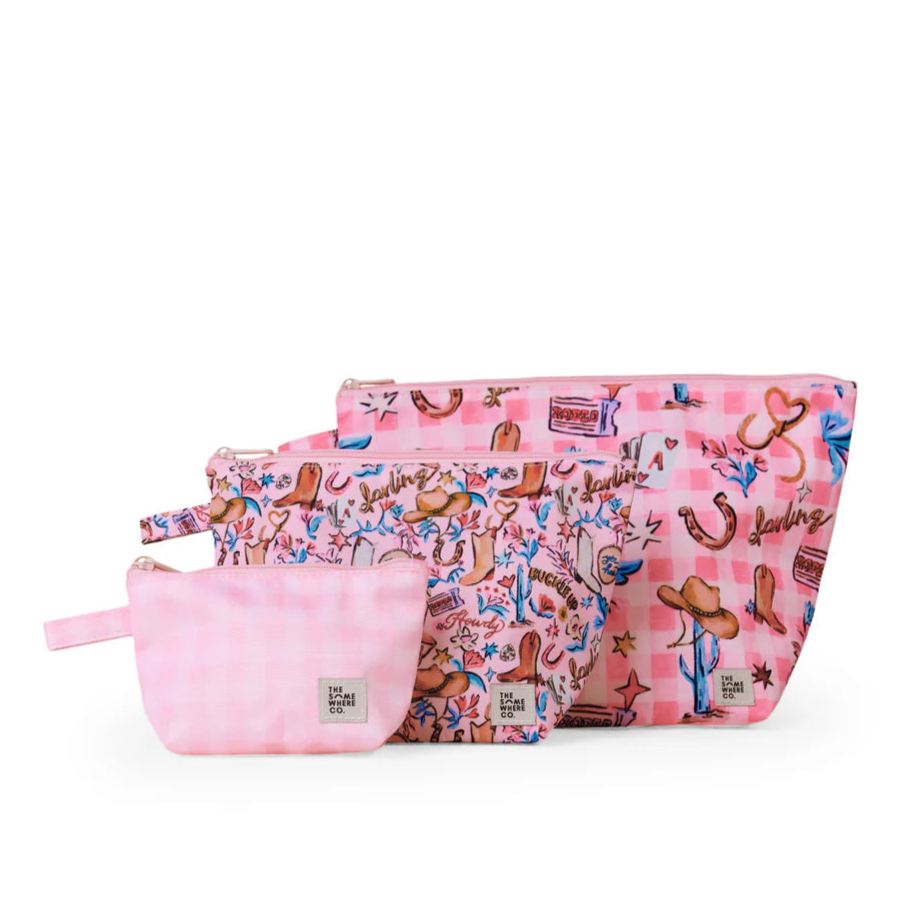 Set of pink pouches with cowboy design on a white background
