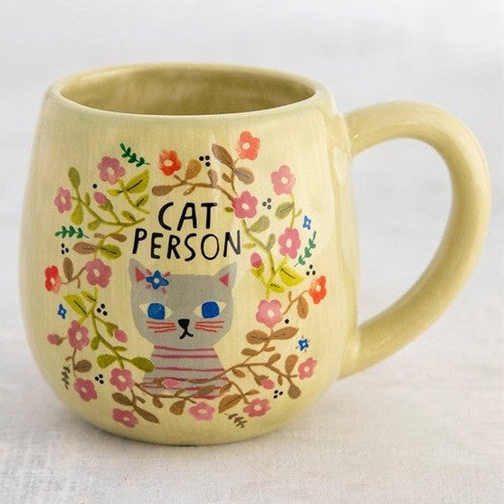 Yellow mug with a cat illustration and 'Cat Person' text on a white background