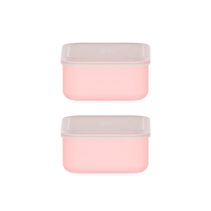Two pink containers with white lids on a white background