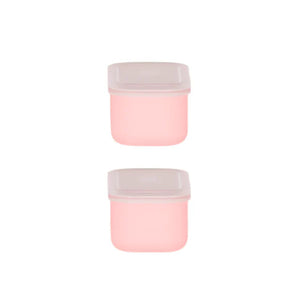 Two pink containers with white lids on a white background