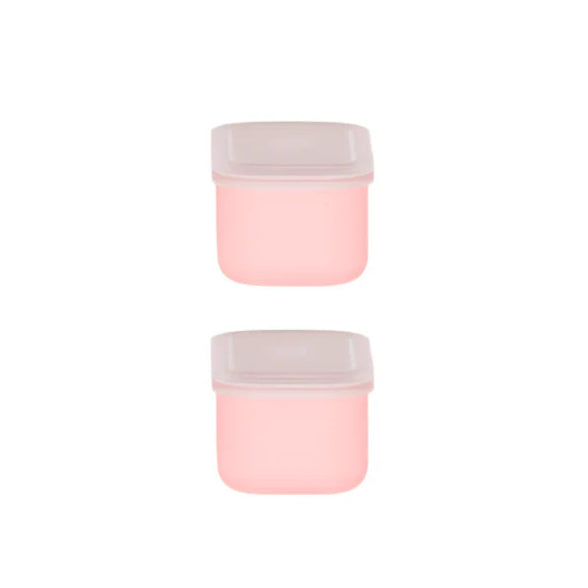 Two pink containers with white lids on a white background
