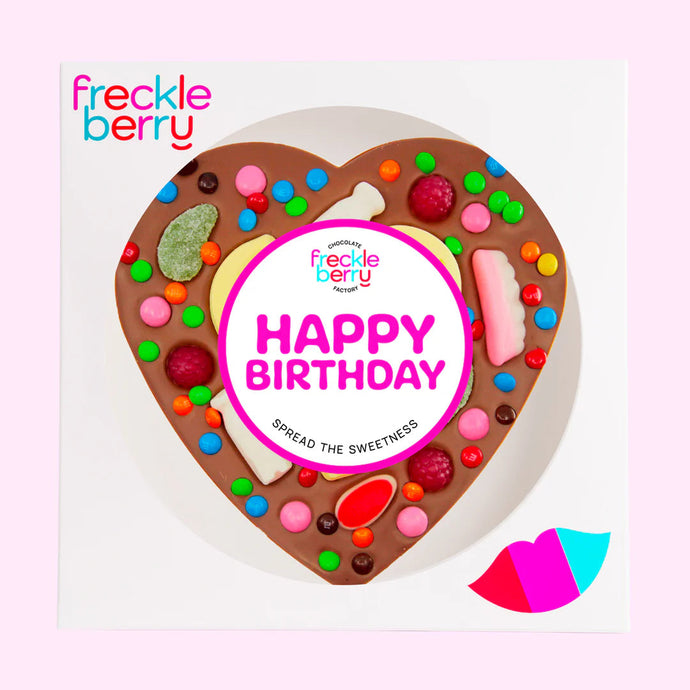 Heart-shaped chocolate bar with colorful candies and 'Happy Birthday' text, branded 'freckle berry'.