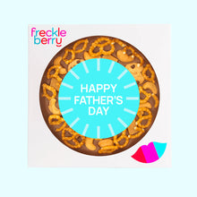 Load image into Gallery viewer, Fathers Day chocolate pizza topped with pretzels, cookies, cashews and caramel fudge and a &#39;Happy Father&#39;s Day&#39; message on a light blue background.