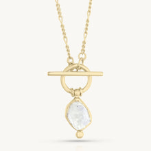 Load image into Gallery viewer, Gold necklace with a pendant featuring a clear gemstone on a white background
