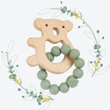 Load image into Gallery viewer, Wooden teddy bear-shaped teether with green beads on a white background with floral elements.