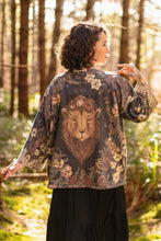 Load image into Gallery viewer, Woman wearing a patterned kimono with a lion design in a forest setting