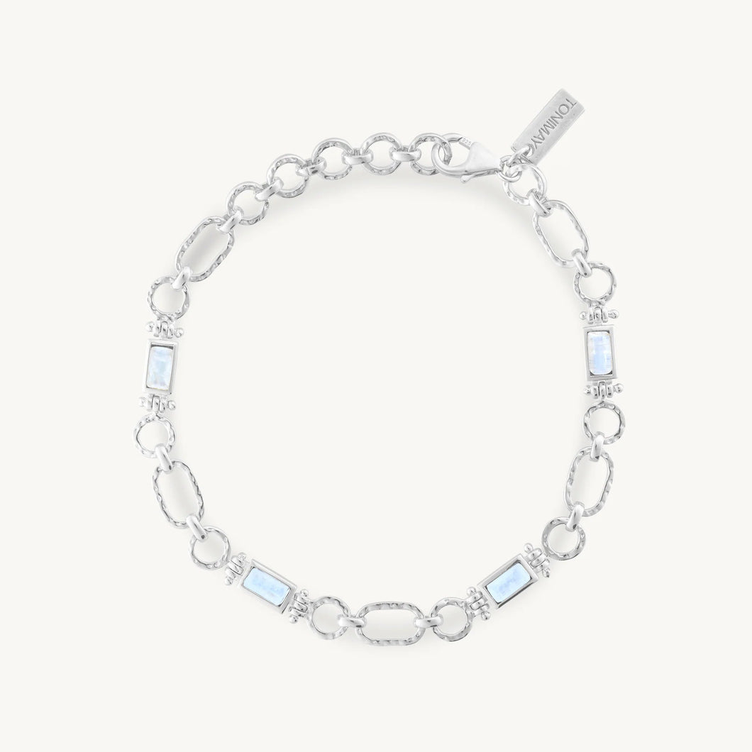 Silver bracelet with moonstones on a white background