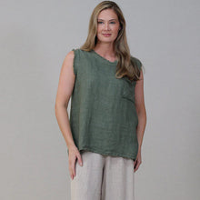 Load image into Gallery viewer, Woman wearing a green sleeveless top and beige pants against a plain background