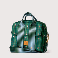 Load image into Gallery viewer, A green plaid and striped tote bag with a small bee pattern, featuring dual top handles, a front flap pocket, and a detachable shoulder strap, shown on a light gray background.
