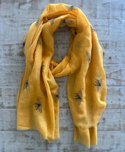 Load image into Gallery viewer, Yellow scarf with bee patterns on a textured surface